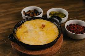 Queso fundido con champiñones
