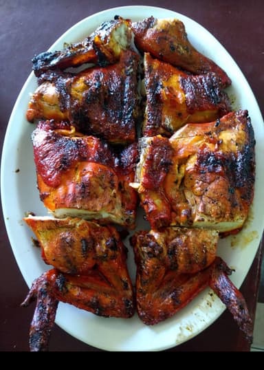 Medio pollo adobado.