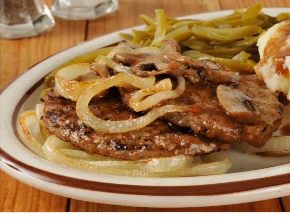 bistec encebollado