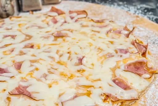 Pizza Jamón y Queso (porción)