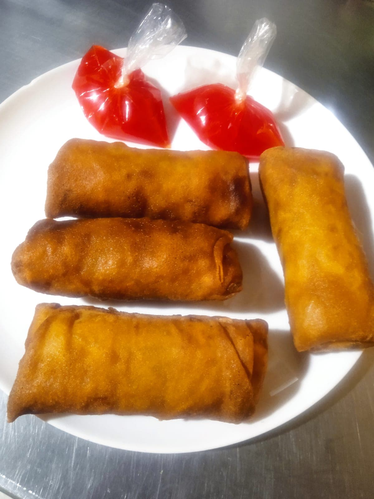 Porción de 4 lumpias más salsa agridulce