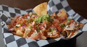 Nachos la Tinga` más Gaseosa