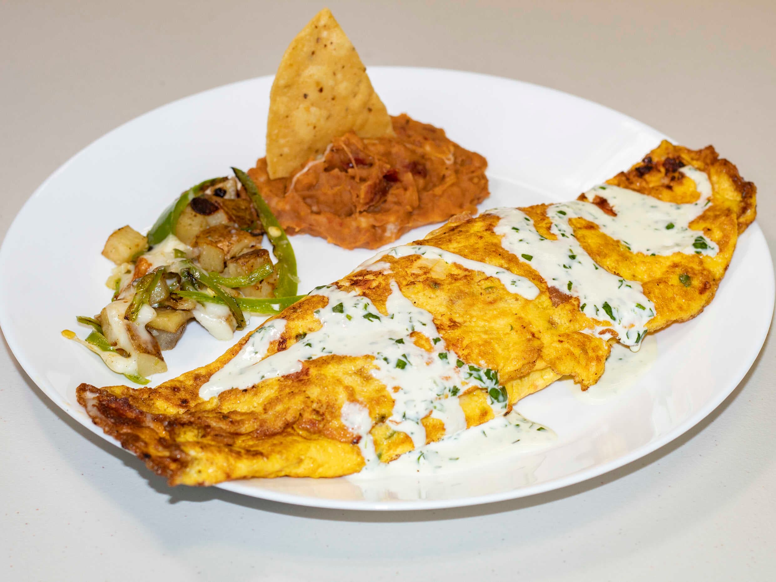 Omelette jamón con tocino y jamon