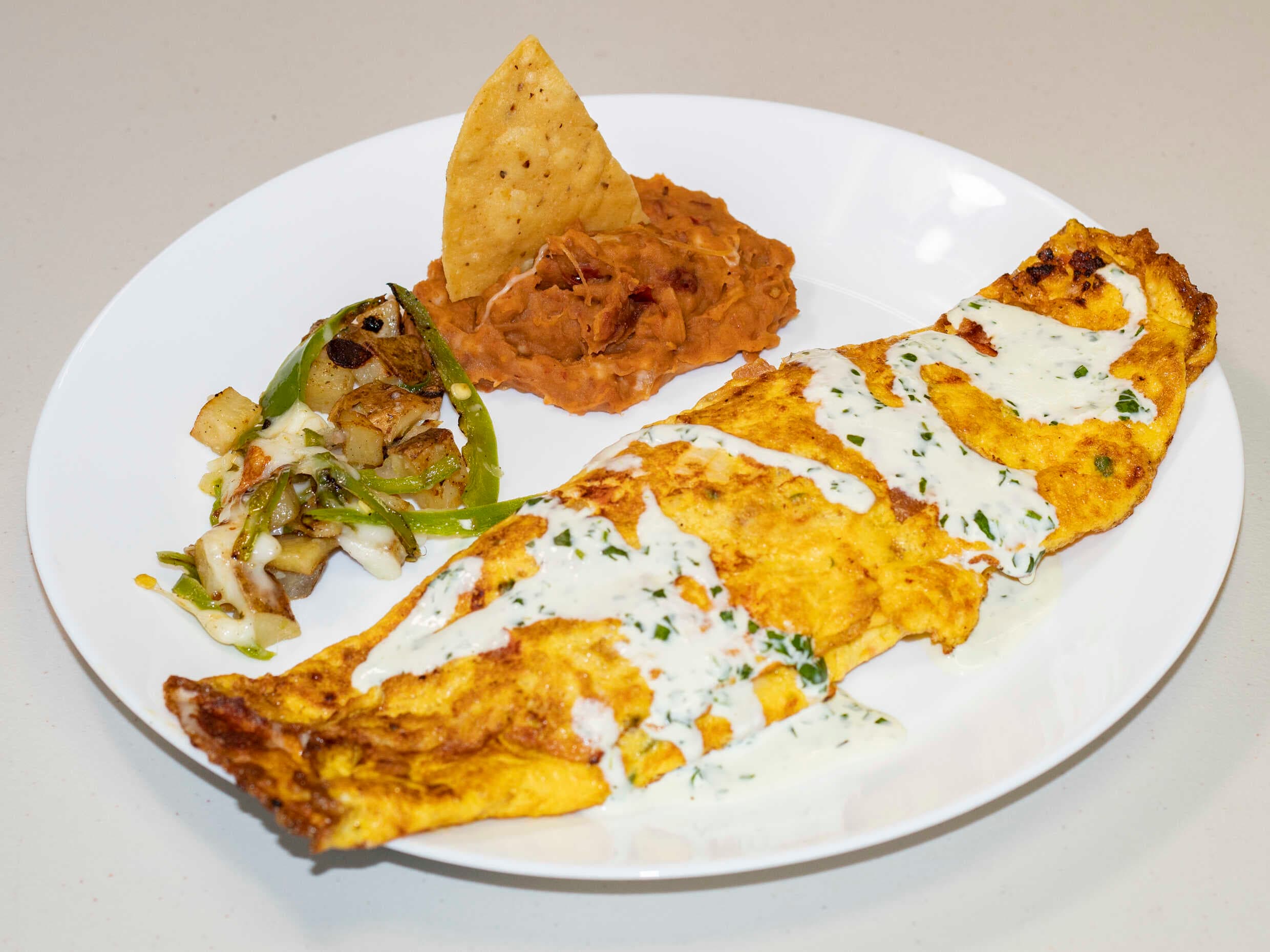 Huevos al gusto con tocino y jamón