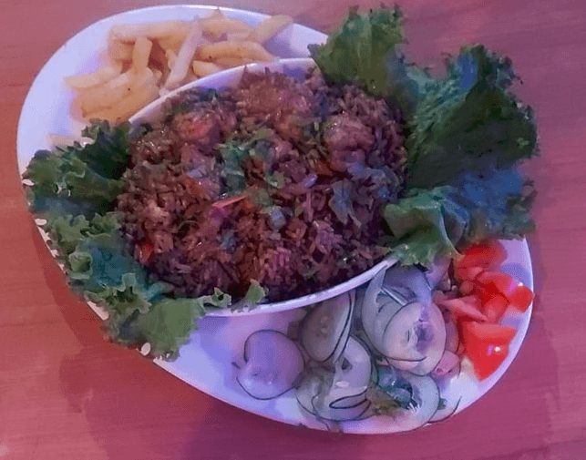 Medio Arroz Caribbean (Pollo,Carne,Cerdo)+Bebida