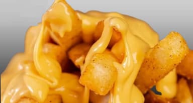 Papas Fritas con queso cheddar