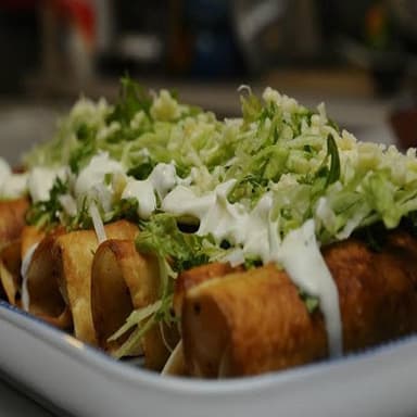 2 Tacos Dorados + Soda