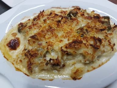 Jaiba Gratinada + Patacón y Queso Parmesano.
