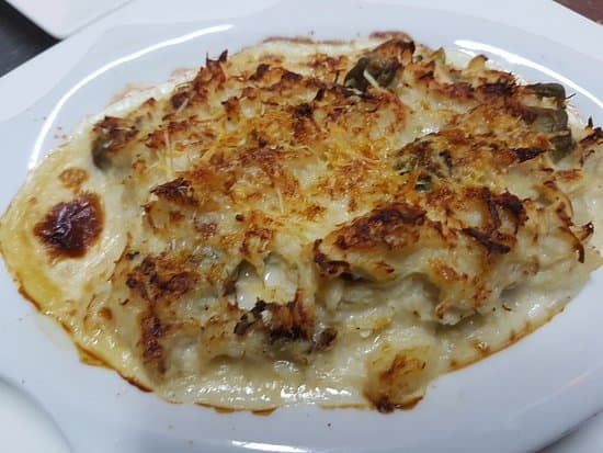 Jaiba Gratinada + Patacón y Queso Parmesano.