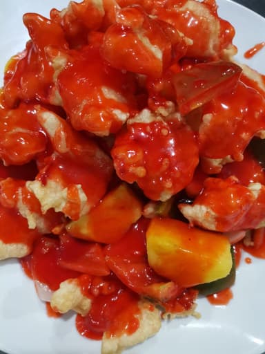 Trozo de pescado en salsa agridulces