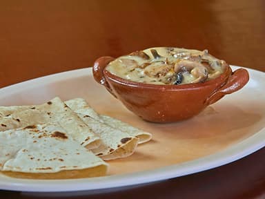 Champiñones con Queso Fundido