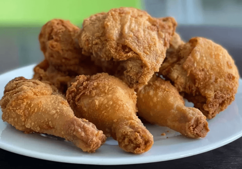 Una Presa De Pollo - Muslo Apanado