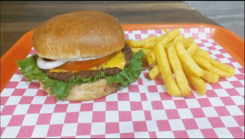 Hamburguesa del dia con Queso + Papas