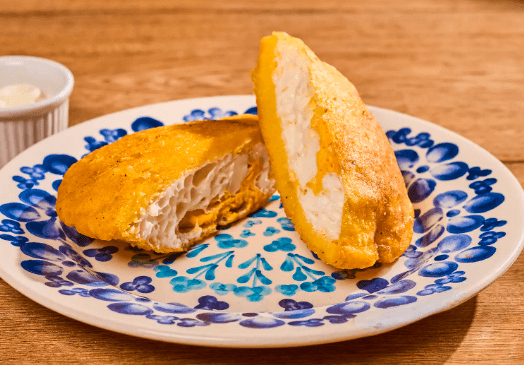 1 Arepa con Huevo + 1 Jugo de Naranja