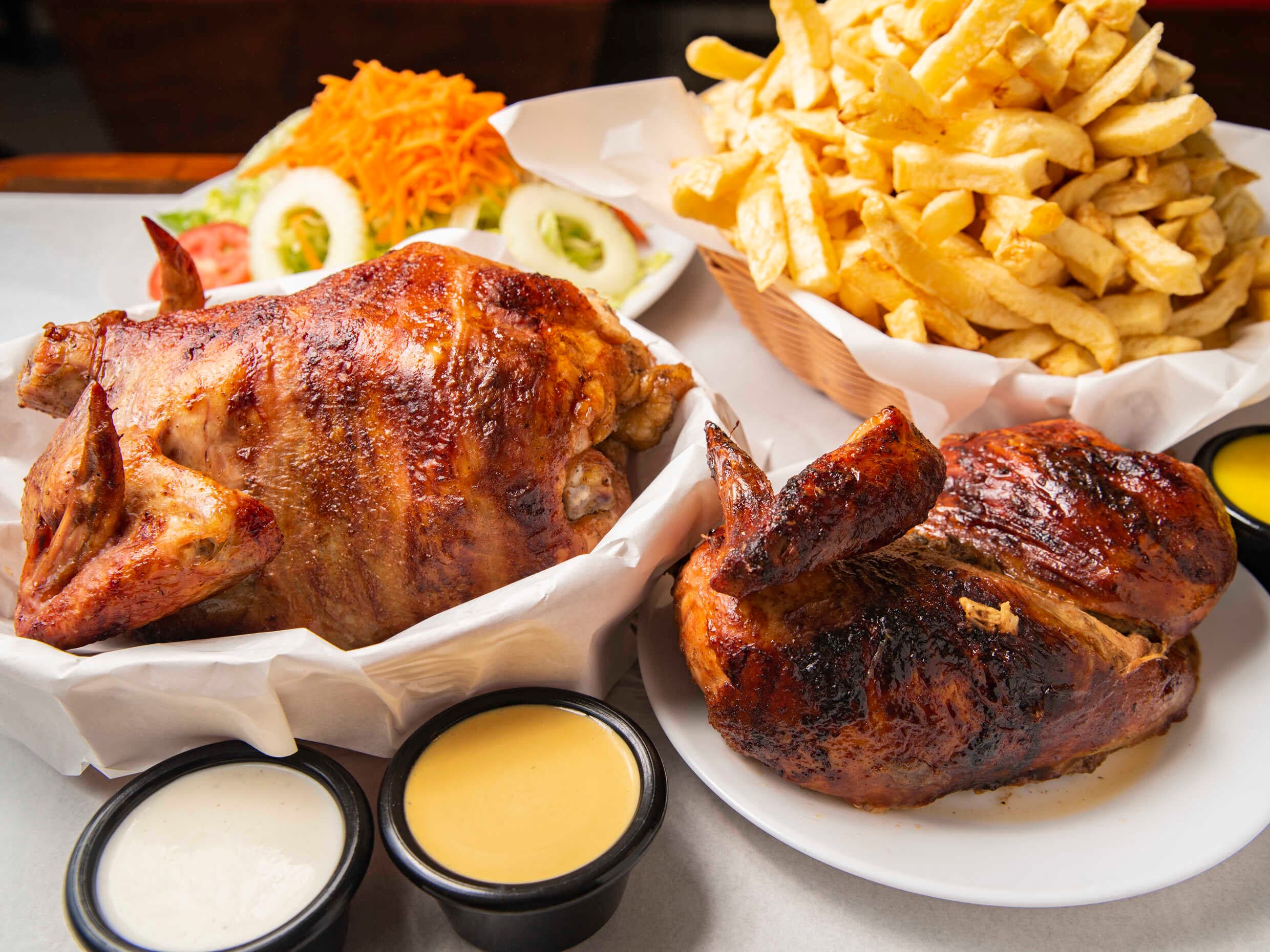 1 Pollo + 1/2 Pollo a la Brasa