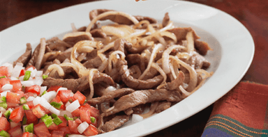 Bisteces Encebollados