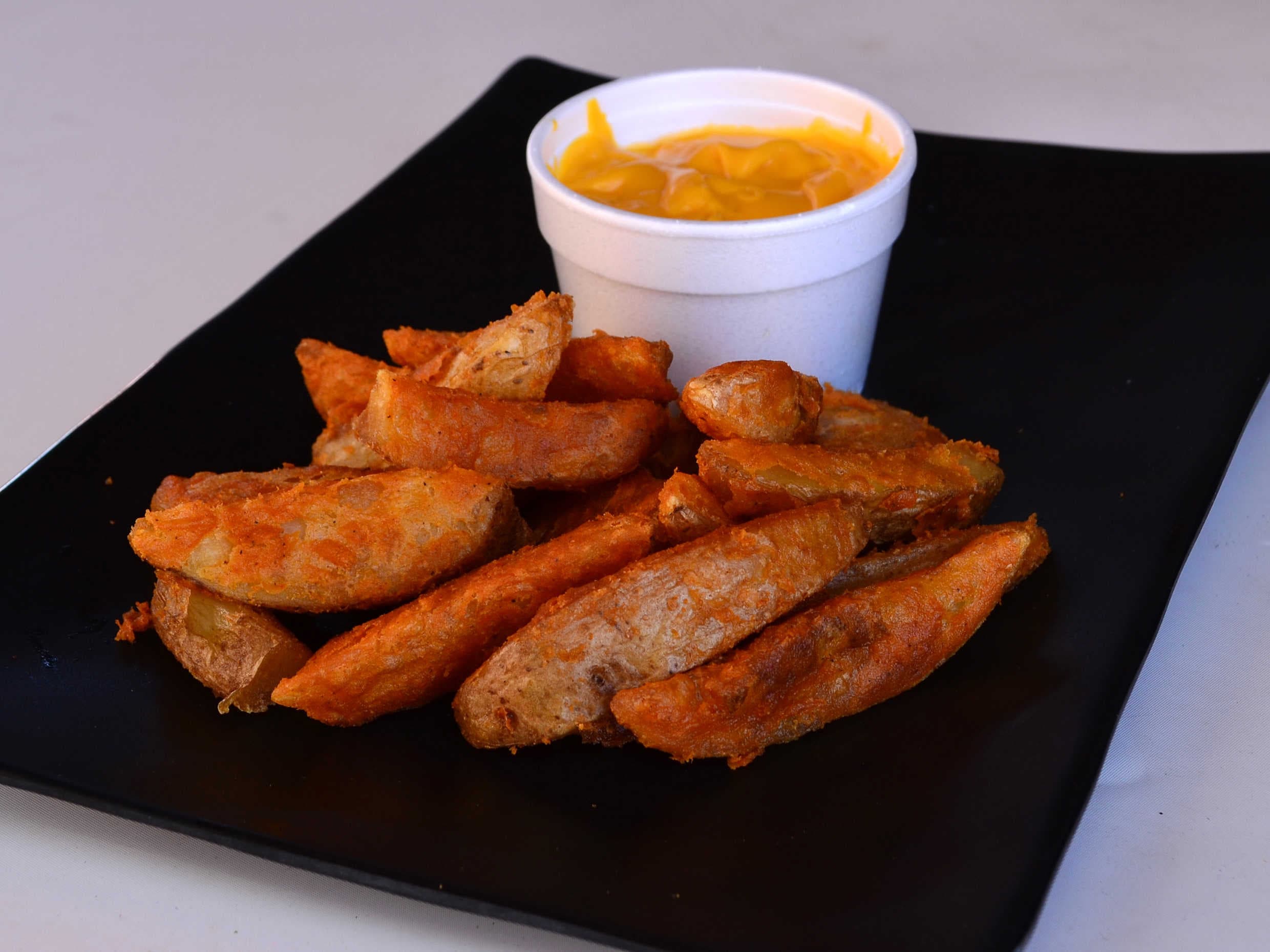 Papas Sazonadas con queso