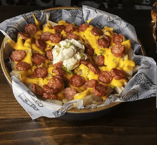 Promo Papa con Tocineta Salsa Cheddar.