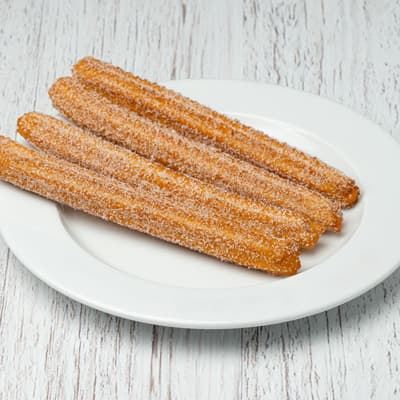 Churros con azúcar y canela