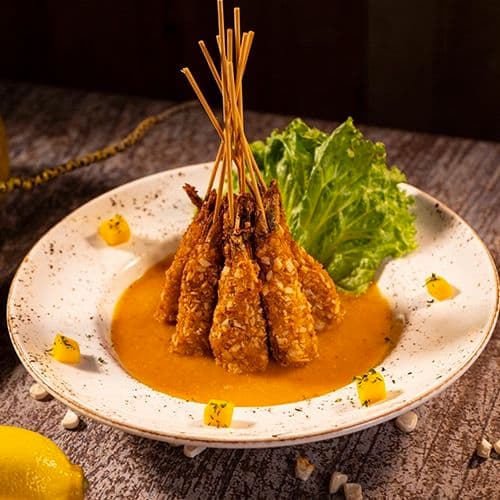 Fondue de mango con camarones