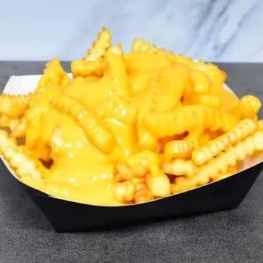 Papas con Salsa Queso Cheddar