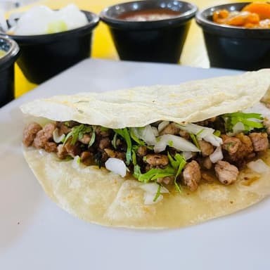2 Tacos de Harina de Trompo + Jamaica