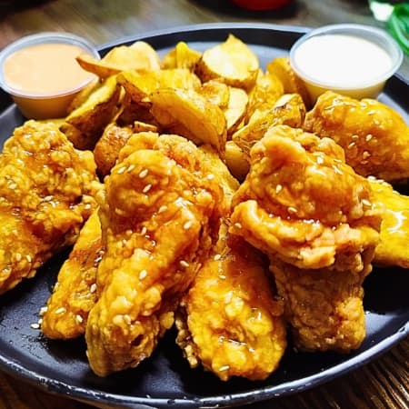 Alitas Maracuyá 6und+papas nativas