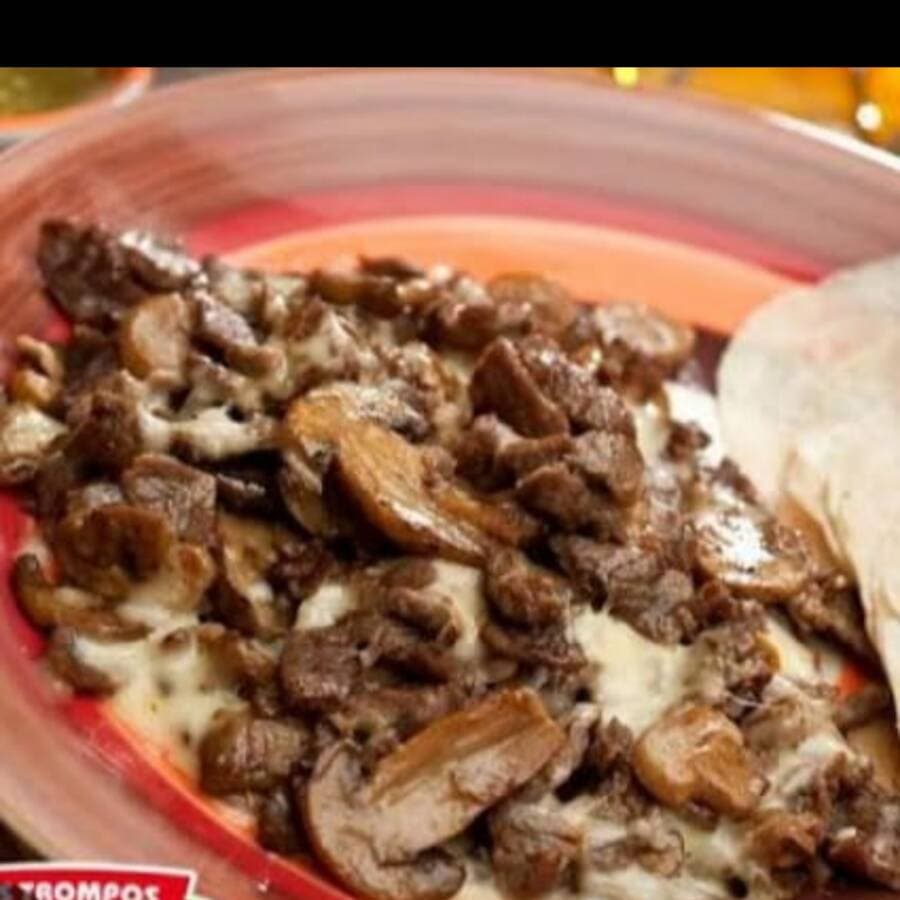 Bistec con  Champiñones