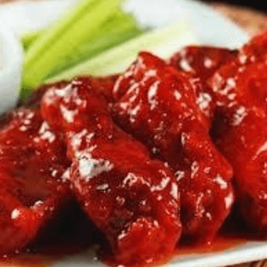 Alitas Bañadas