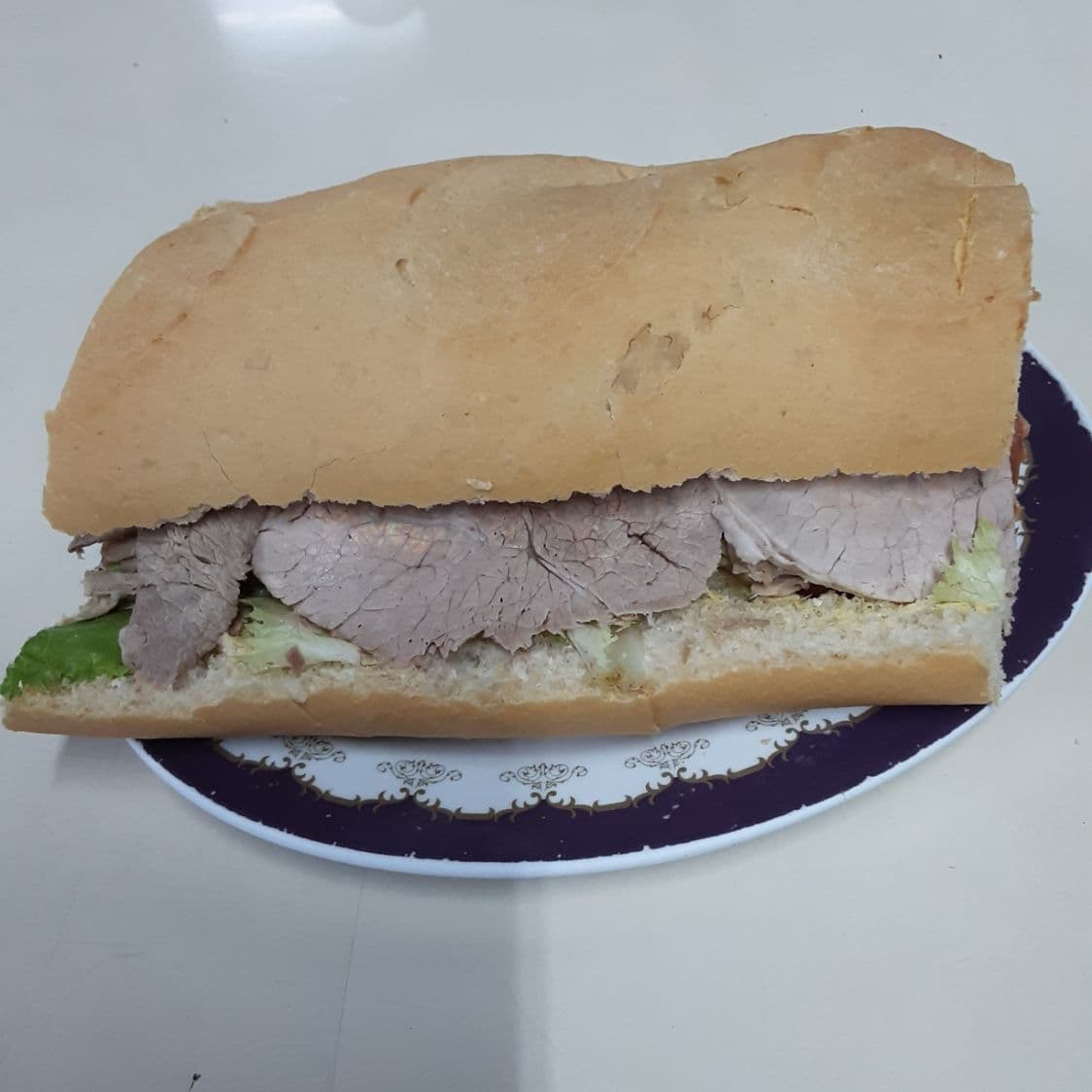 Emparedado de Carne mano de Piedra.