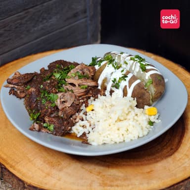 Cabeza de Lomo de Cerdo Marinado con Papa al Horno