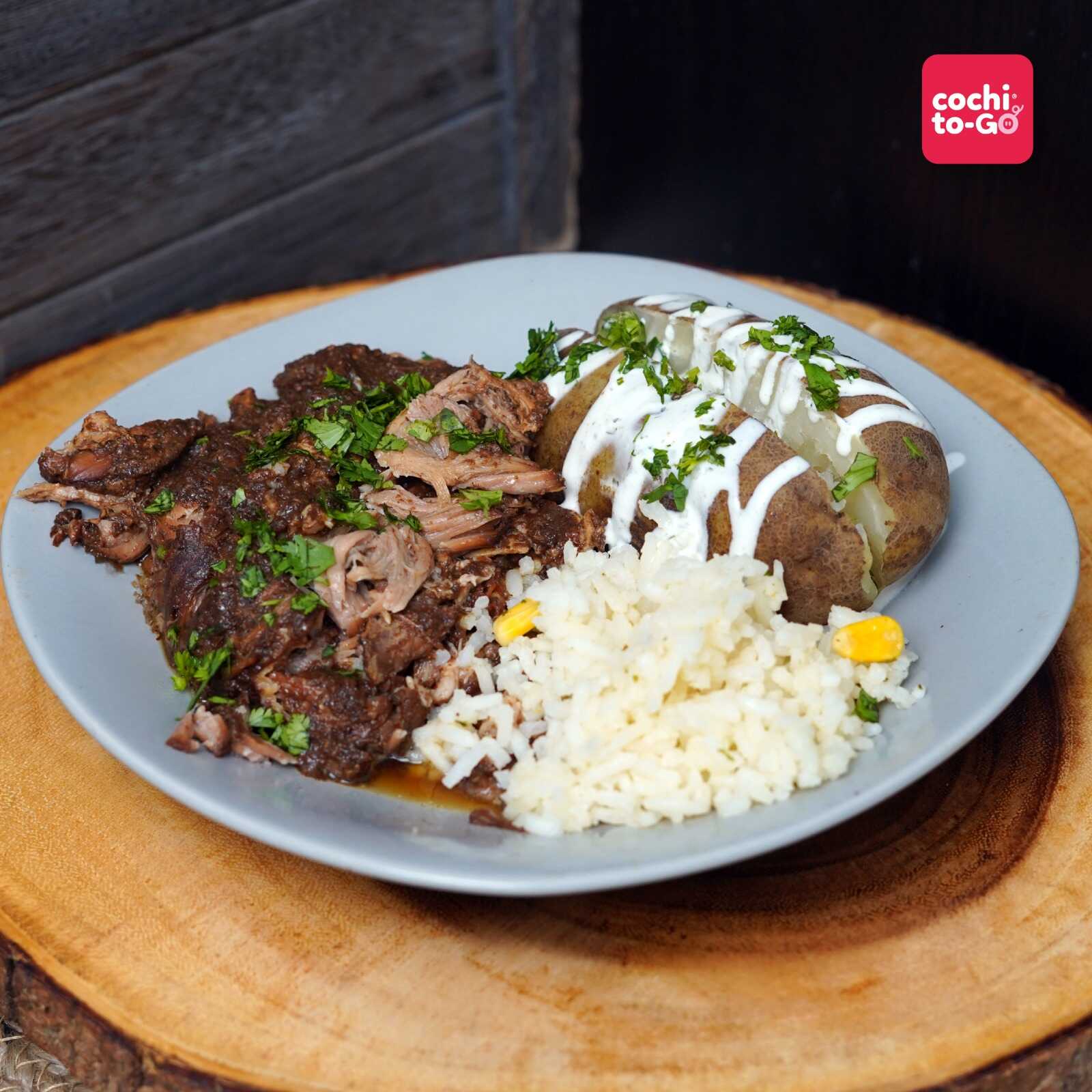 Cabeza de Lomo de Cerdo Marinado con Papa al Horno