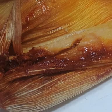 Tamal hoja de maíz adobo de puerco