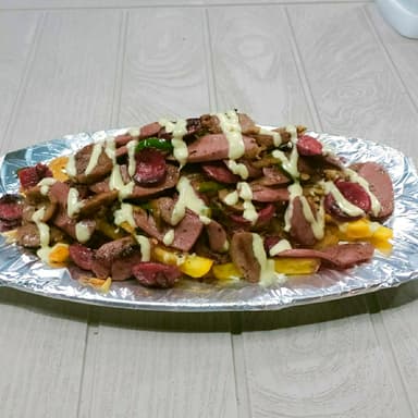 Salchipapa con Chorizo y Butifarra