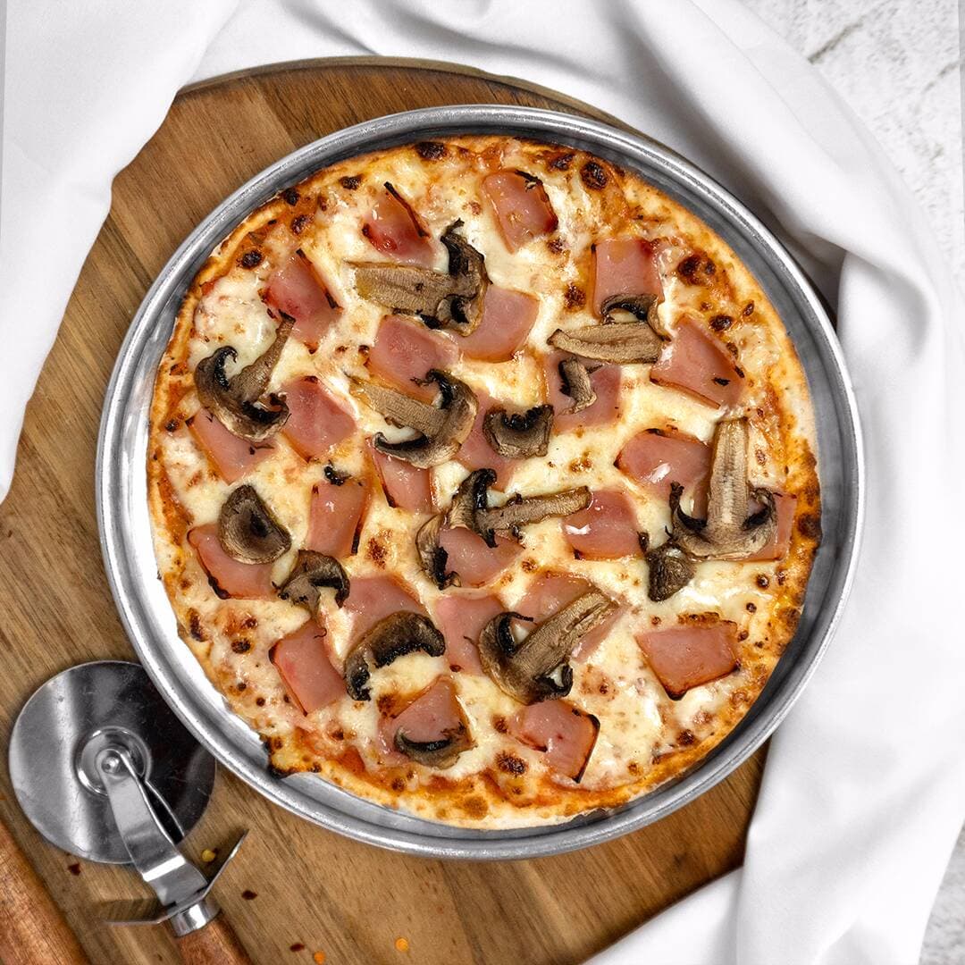 Pizza de Jamón y Champiñones