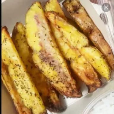 Porción de Papas a las Finas Hierbas