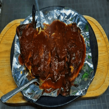 Medio pollo enchipotlado