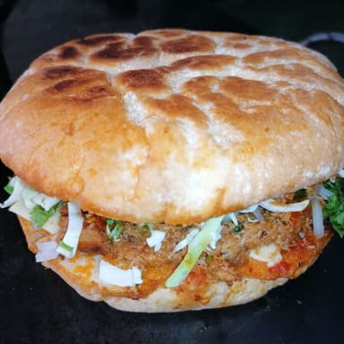 Torta de Birria y Vaso de Consomé
