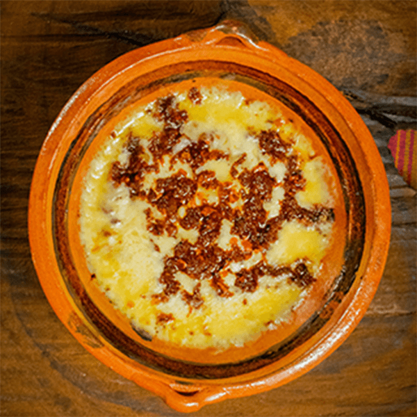 Queso Fundido con Champiñones.