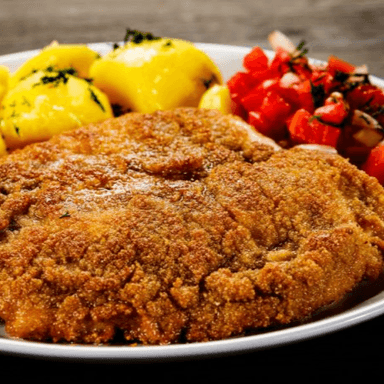 BISTECK DE PUERCO EMPANIZADO