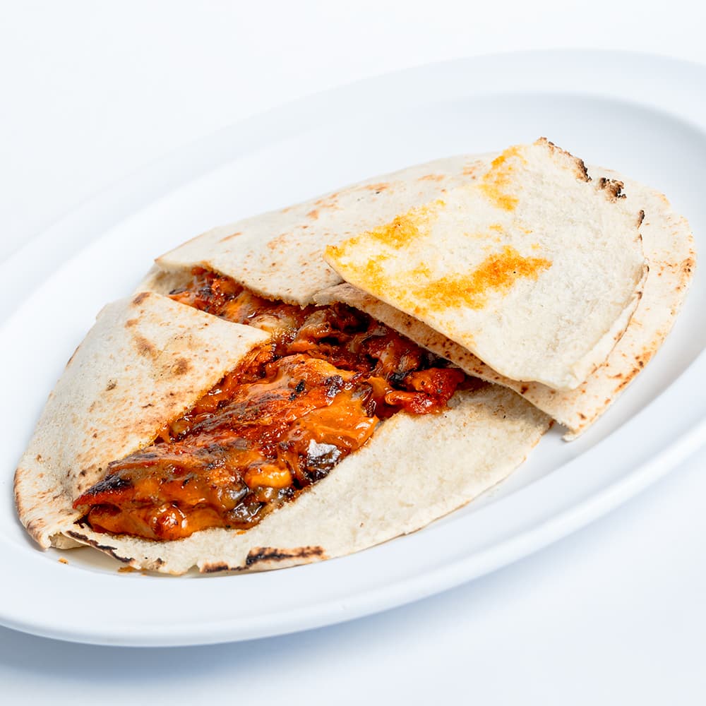 GRINGA EN PAN ARABE PASTOR (1)pza 250grs