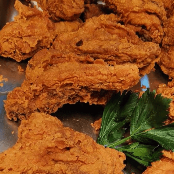 Porción de Pollo Frito ( Cuarto y Muslo)