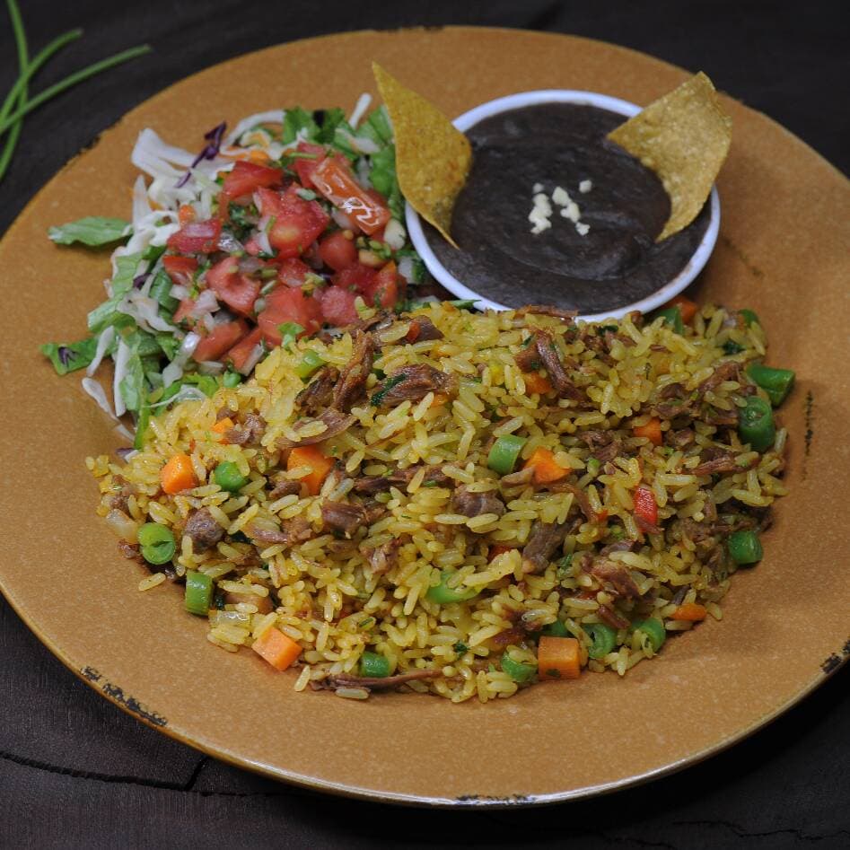 Arroz con Cerdo + Refresco Natural