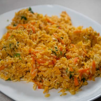 2 Arroz con Pollo + Orden Frijoles + PapasTostadas