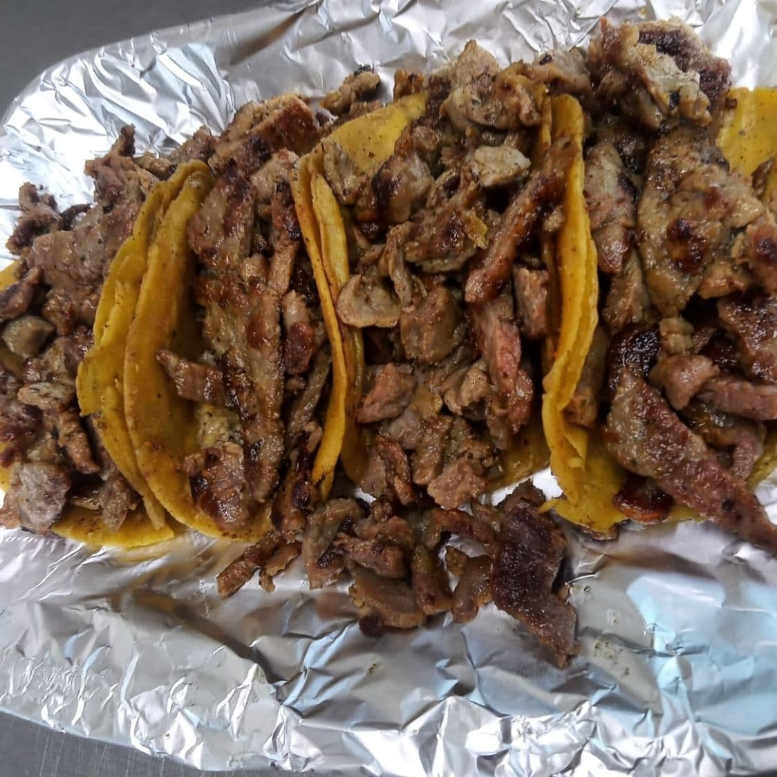 Combo 4 tacos de bistec coca de lata y una papa