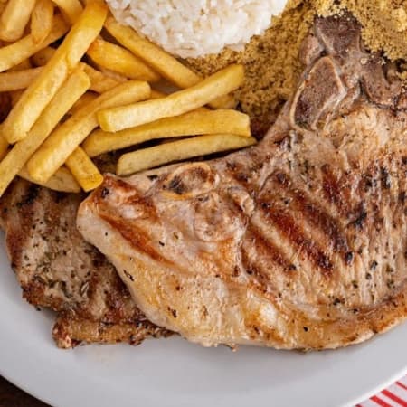 Chuleta + Papas Fritas + Arroz + Ensalada
