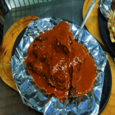 Medio pollo adobado