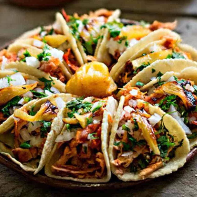 PAQUETE AMIGOS - 20 Tacos de Pastor + 3 Cocas