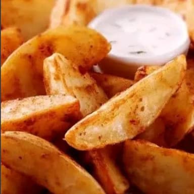 Papas Gajo Con Salsa Ranch Y Queso Parmesano
