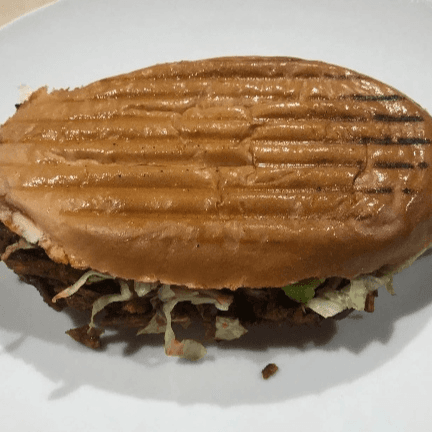 Torta de pastor con queso Oaxaca